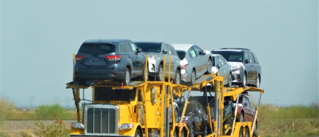 trucking-yellow-big-rig-hauling-a-yellow-car-haul-2026-03-19-06-42-19-utc